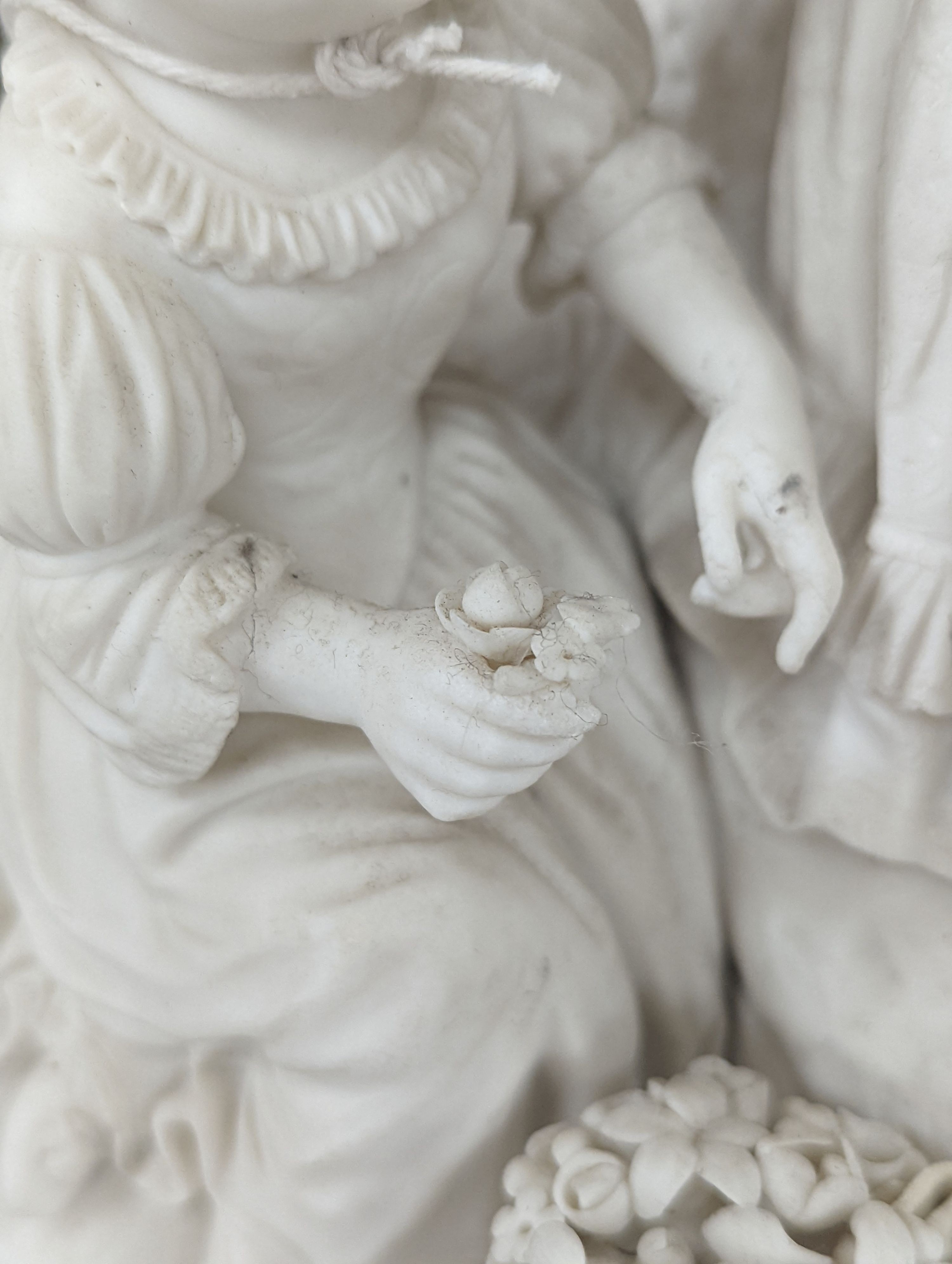 A 19th century Adams & Co. parian group of a man, woman, child and dog 31cm